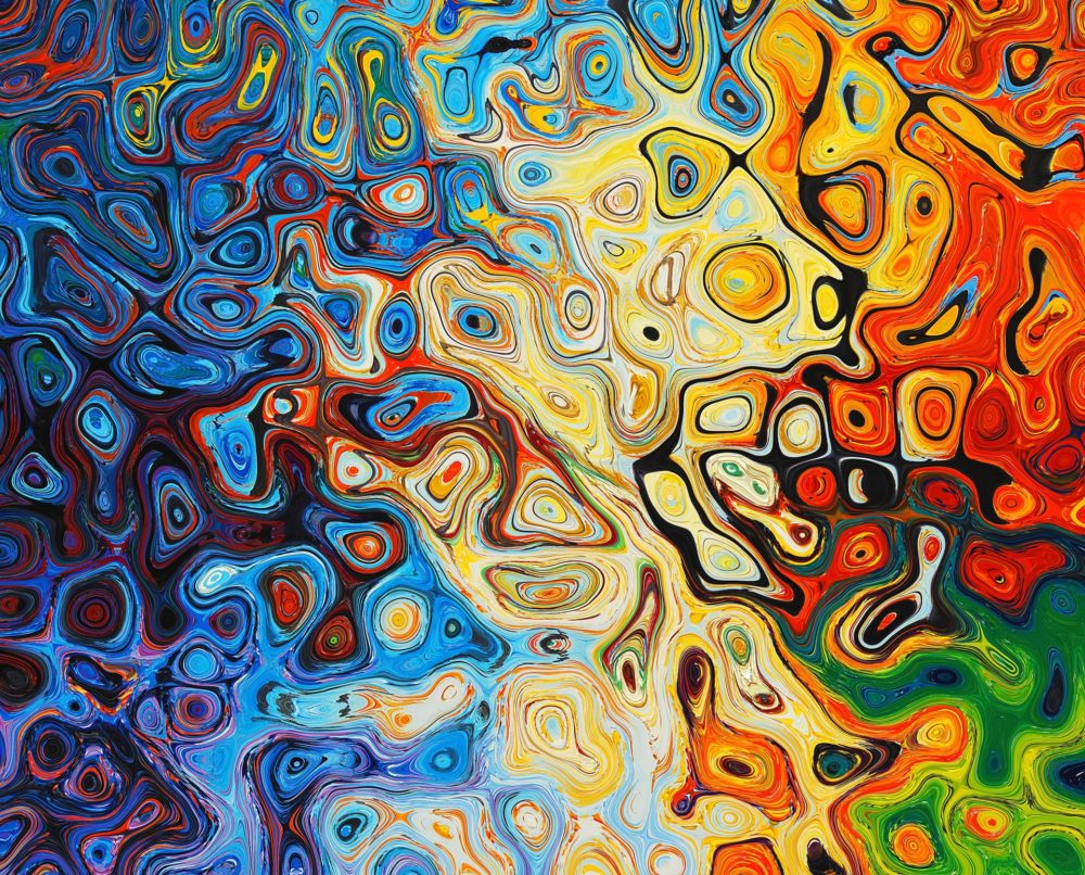 An abstract swirl of colors, fading from blue to yellow to red and green as you scan from left to right.